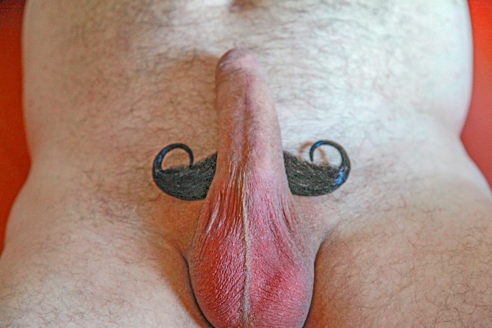 Male erected penis and testicles with mustache